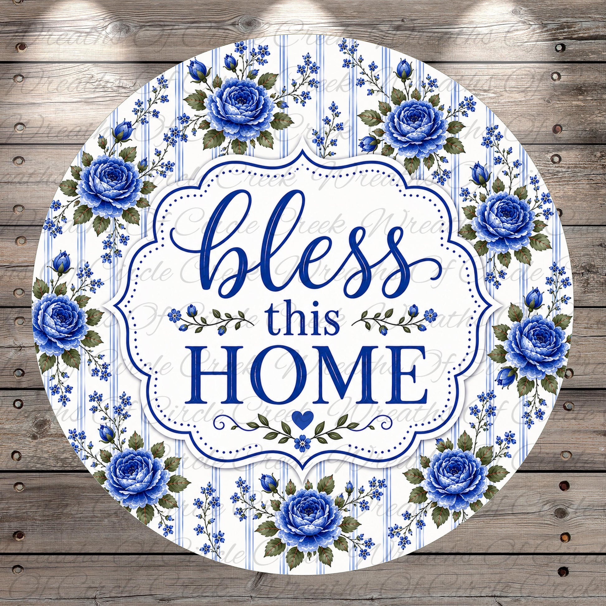 A round sign with a floral border and the text "bless this home" in blue and white.